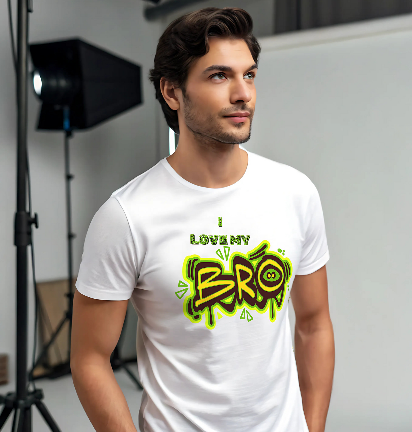 Man wearing a white t-shirt with colorful text design in a studio setting