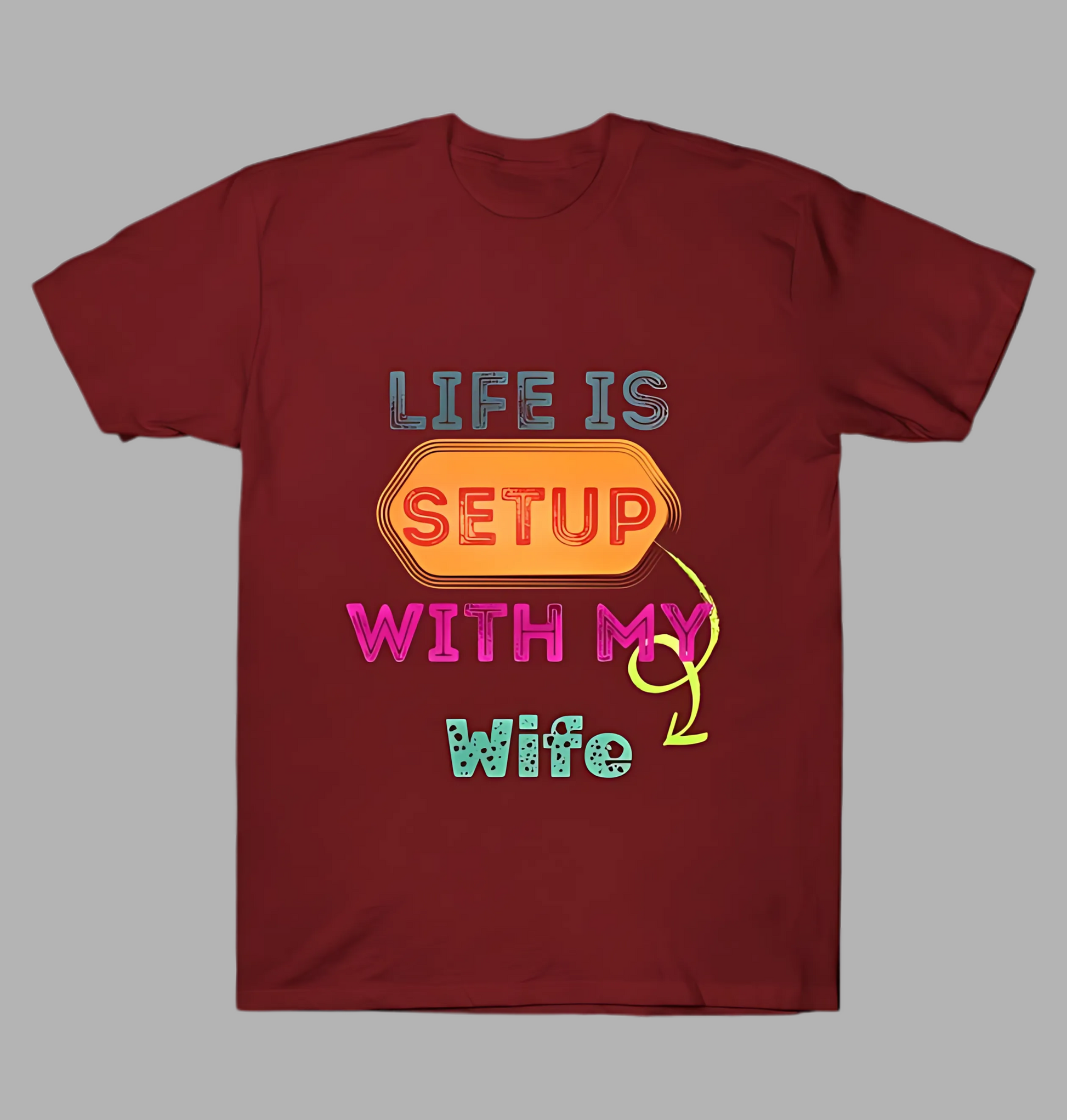 Maroon t-shirt with colorful text design on a gray background